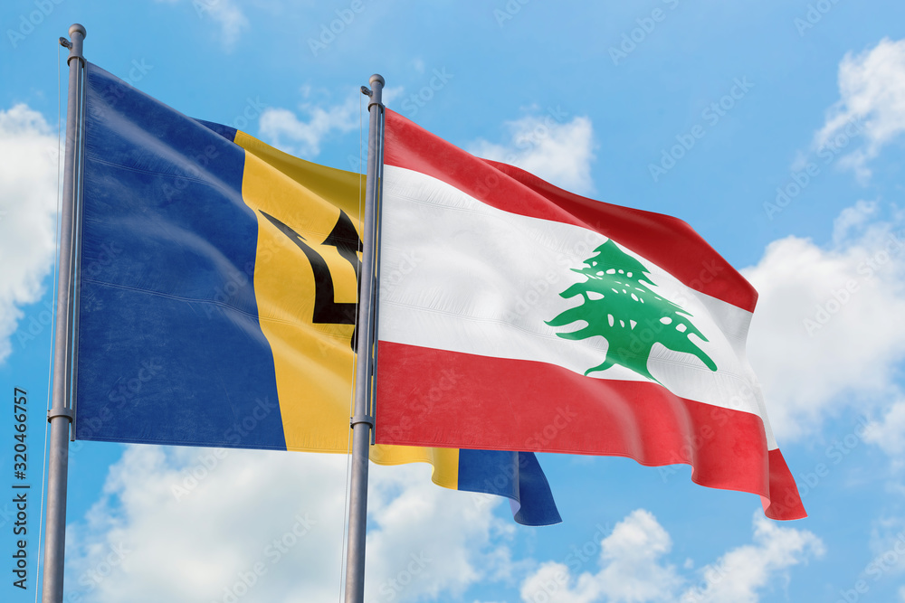Lebanon and Barbados flags waving in the wind against white cloudy blue sky together. Diplomacy concept, international relations. Lebanon and Barbados flags waving in the wind against white cloudy blue sky together. Diplomacy concept, international relations.