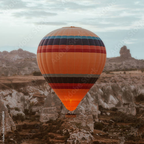 Hot air balloon flying over Cappadocia dawn