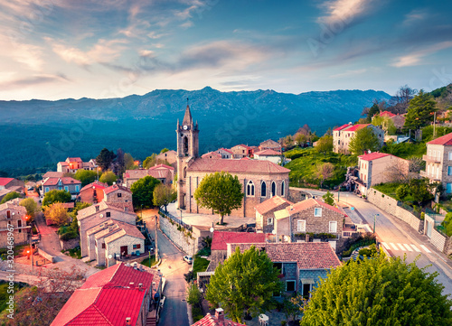 View from flying drone. Astonishing evening cityscape of Zonza town, commune in the Corse-du-Sud department of France. Fantastic sunset on Corsica island, France, Europe. photo