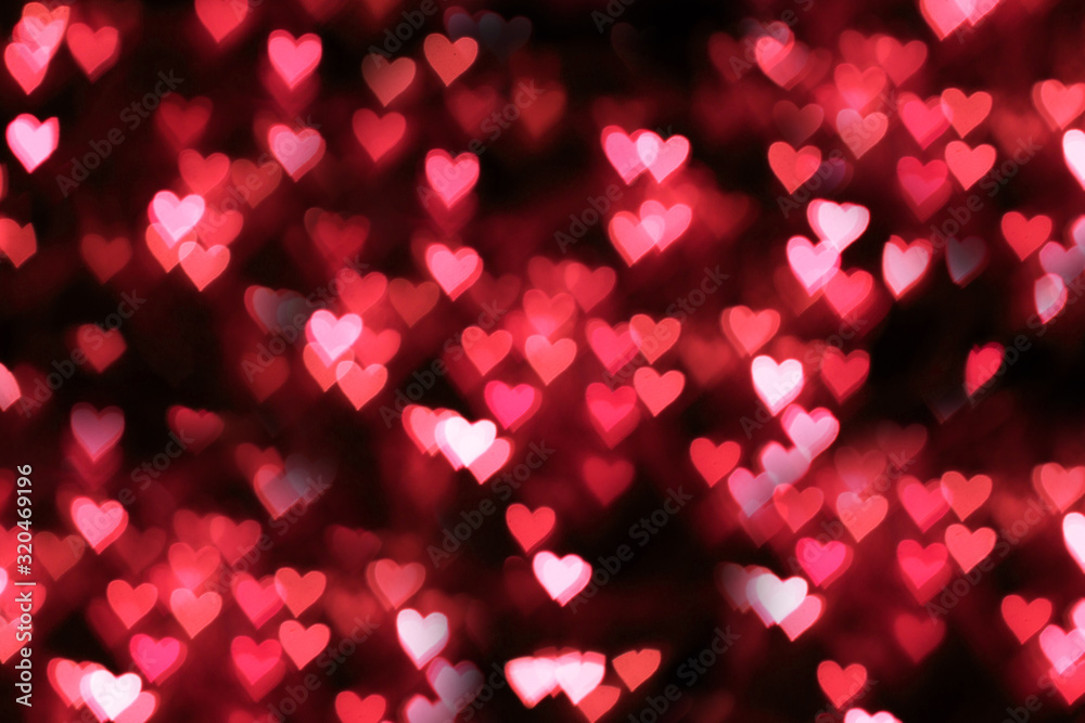 Blurred background, bokeh in the form of a heart of red color. Blurred background, bokeh in the form of a heart of red color.