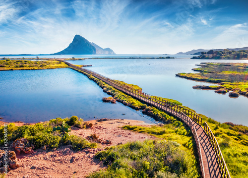 Fototapeta Naklejka Na Ścianę i Meble -  View from flying drone. Splendid spring scene of Spiaggia di Porto Taverna beach. Aerial morning view of Sardinia island, Italy, Europe. Amazing Mediterranean seascape. 