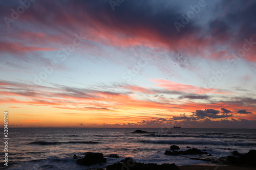 Multi-colored sunset at the ocean © Elena