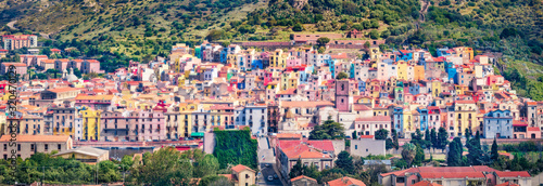 Panoramic morning cityscape of Bosa town, Province of Oristano, Italy, Europe. Colorful summer scene of Sardinia. Architecture traveling background.. © Andrew Mayovskyy