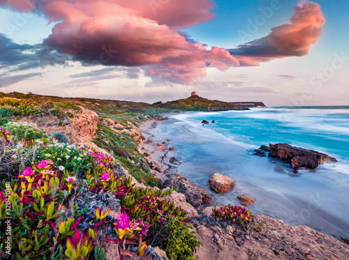 Windy spring scene of Sardinia, Italy, Europe. Fantastic morning view of Capo San Marco Lighthouse on Del Sinis peninsula. Stunning seascape of Mediterranean sea. Traveling concept background.