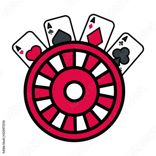roulette wheel and poker cards casino
