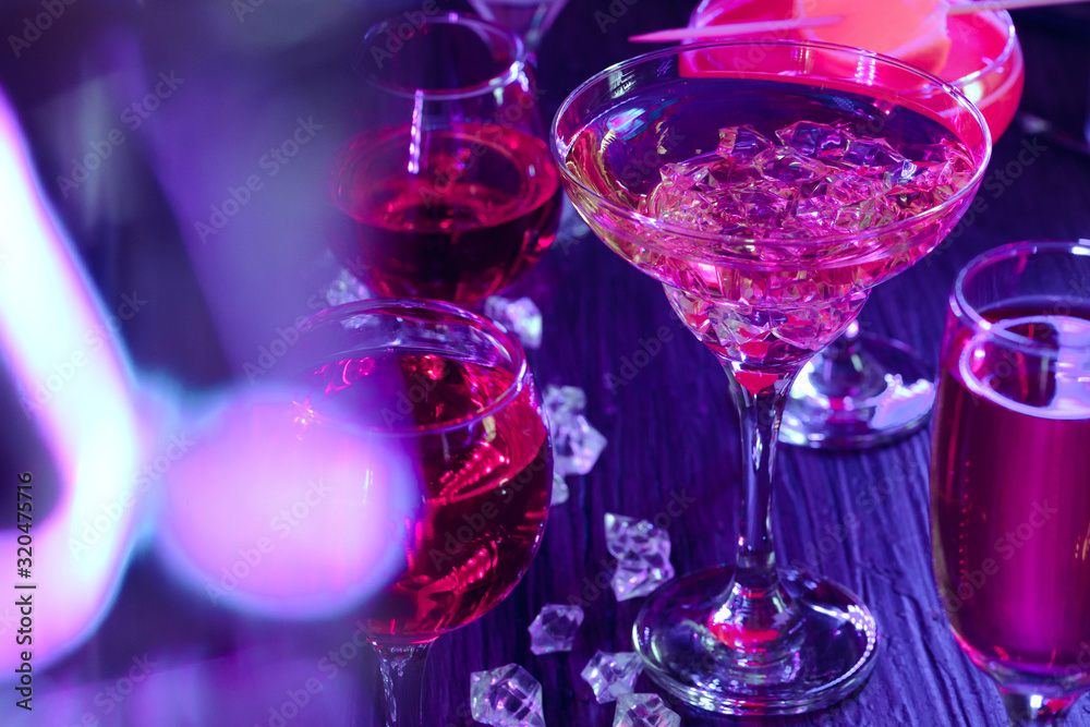 Cocktail drinks with ice in club lights Cocktail drinks with ice in club lights