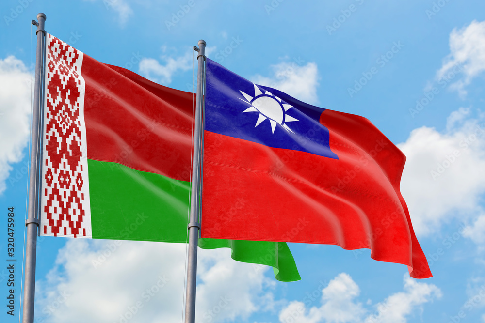 Naklejka premium Taiwan and Belarus flags waving in the wind against white cloudy blue sky together. Diplomacy concept, international relations.