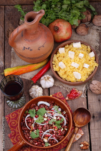 Lobio with corn porridge with cheese and red wine