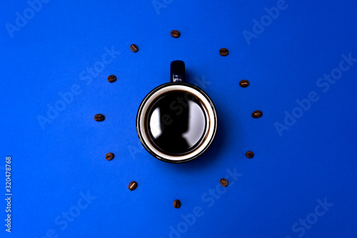 Top view of Cup of coffee on blue background