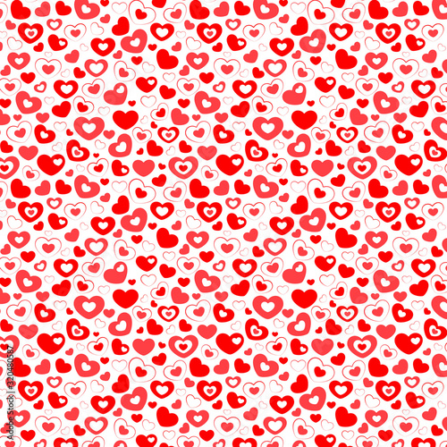 Fotografie Background of red and pink hearts on a white background, decoration for the holi