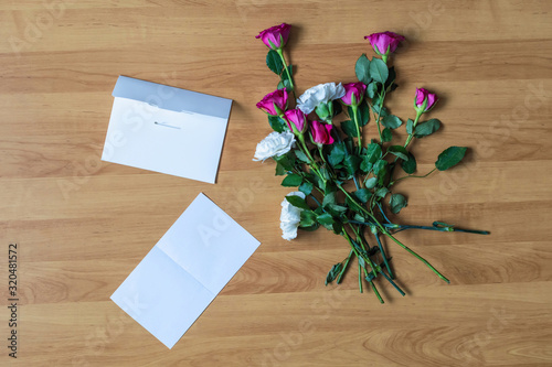 paper of letter and scattered flowers on the floor. Broken relationships in bad Valentine s day. concept.
