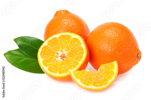 Fototapeta Naklejka Na Ścianę i Meble -  Orange clementine or minneola tangelo with slices and green leaves isolated on white background. Tangerine. Citrus fruit.