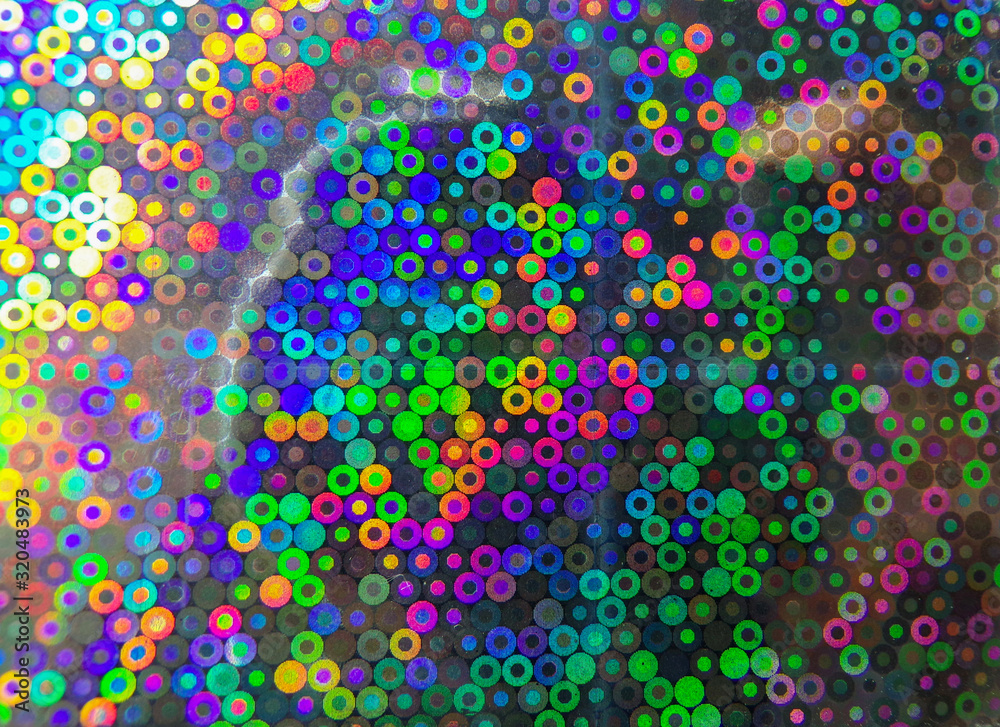 Beautiful and colorful abstract background in the form of multicolored iridescent circles. Original and creative abstract background with iridescent rainbow color.