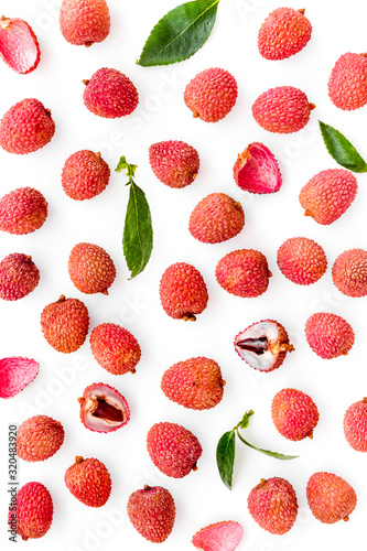 Lychee background. Exotic asian fruits on white background top-down