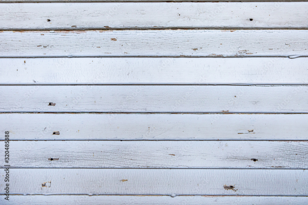 A white wood grungy texture background or old white wood panel. Old weathered wooden plank painted in white color. Vintage wood background A white wood grungy texture background or old white wood panel. Old weathered wooden plank painted in white color. Vintage wood background