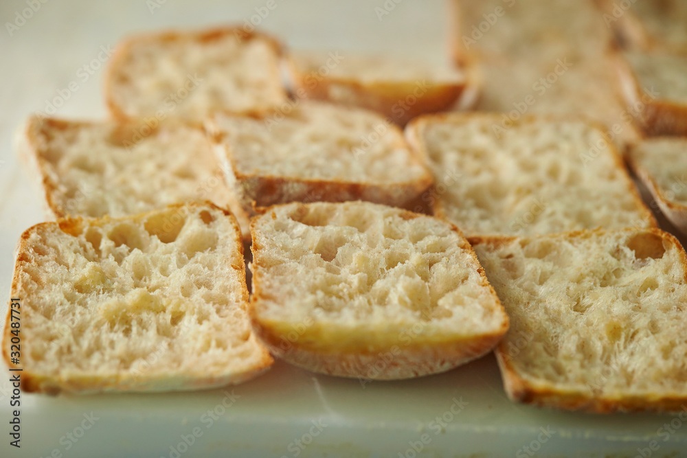 Slicing bread half on cutting board Slicing bread half on cutting board