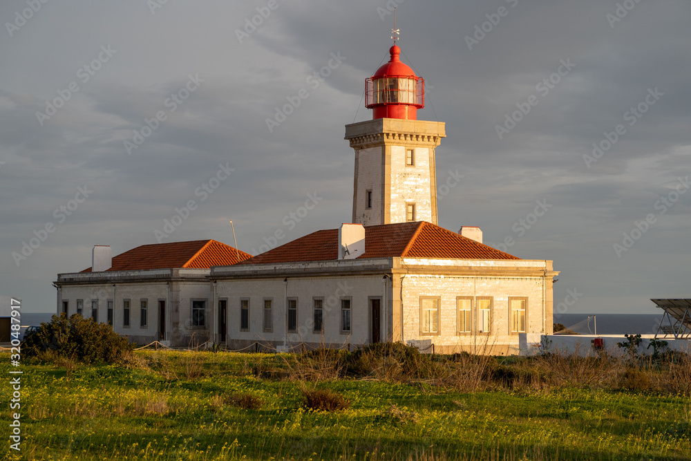 Alfanzina Lighthouse, shot at dusk during the golden hour, with light shining on the building