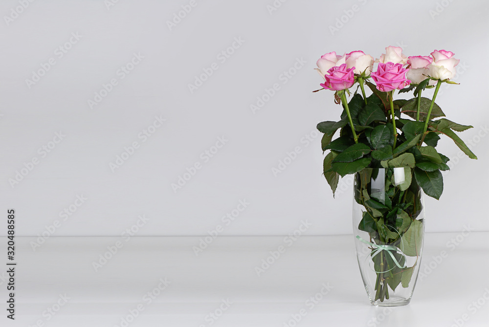 Bouquet of beautiful pink roses on light gray background Bouquet of beautiful pink roses on light gray background