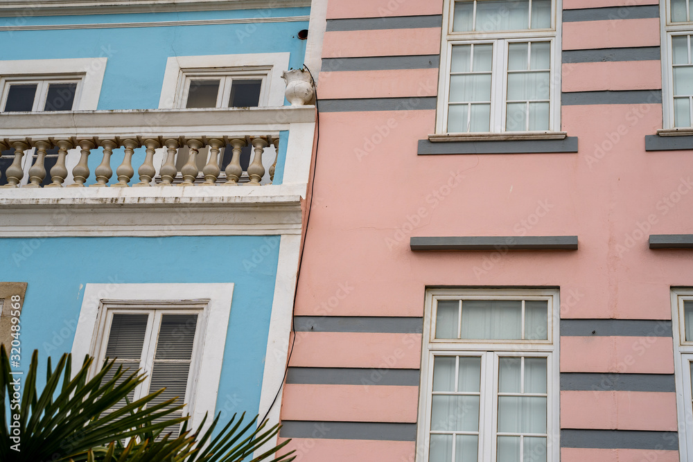 Pastel pink and blue buildings in Lagos, Portugal, in the Algarve region