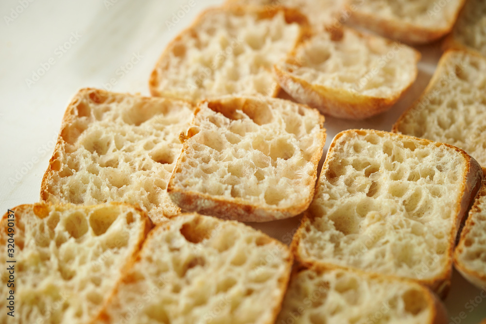Slicing bread half on cutting board Slicing bread half on cutting board