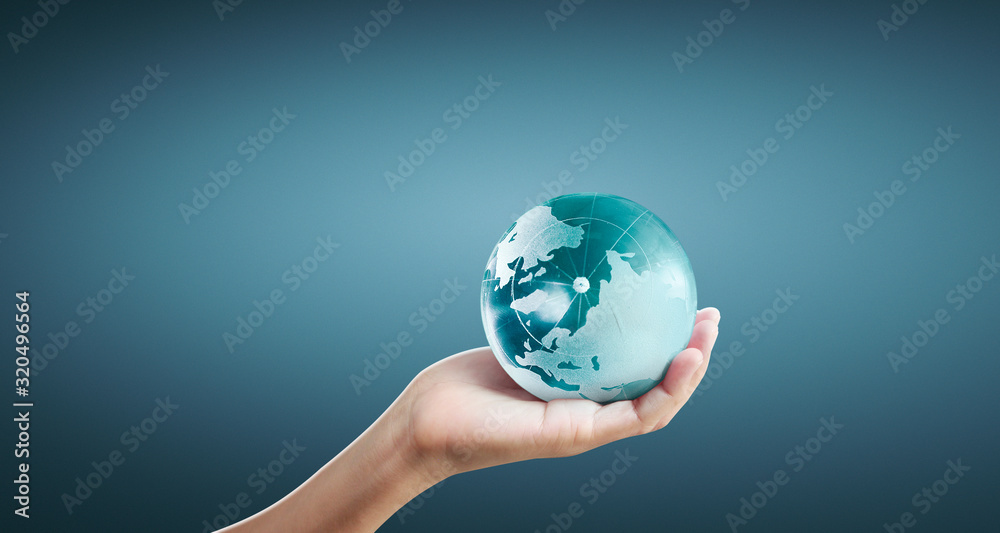 Globe ,earth in human hand, holding our planet glowing Globe ,earth in human hand, holding our planet glowing