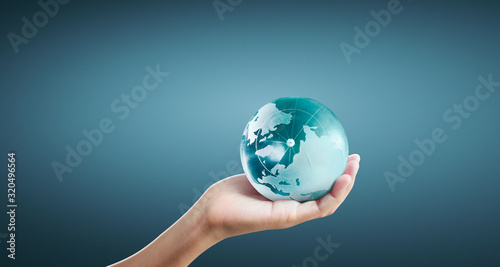 Globe  earth in human hand  holding our planet glowing