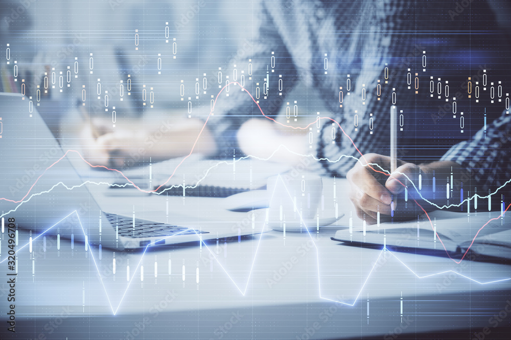 Multi exposure of forex chart with man working on computer on background. Concept of market analysis.