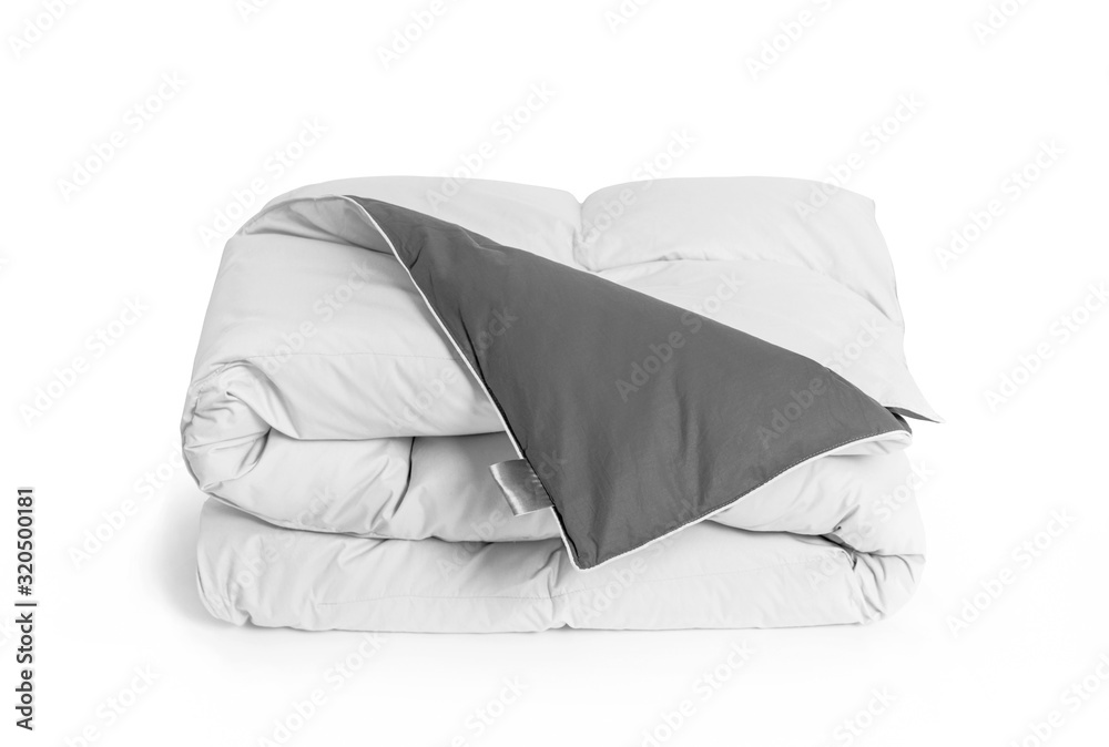 Folded soft white duvet, blanket or bedspread with the gray back side
