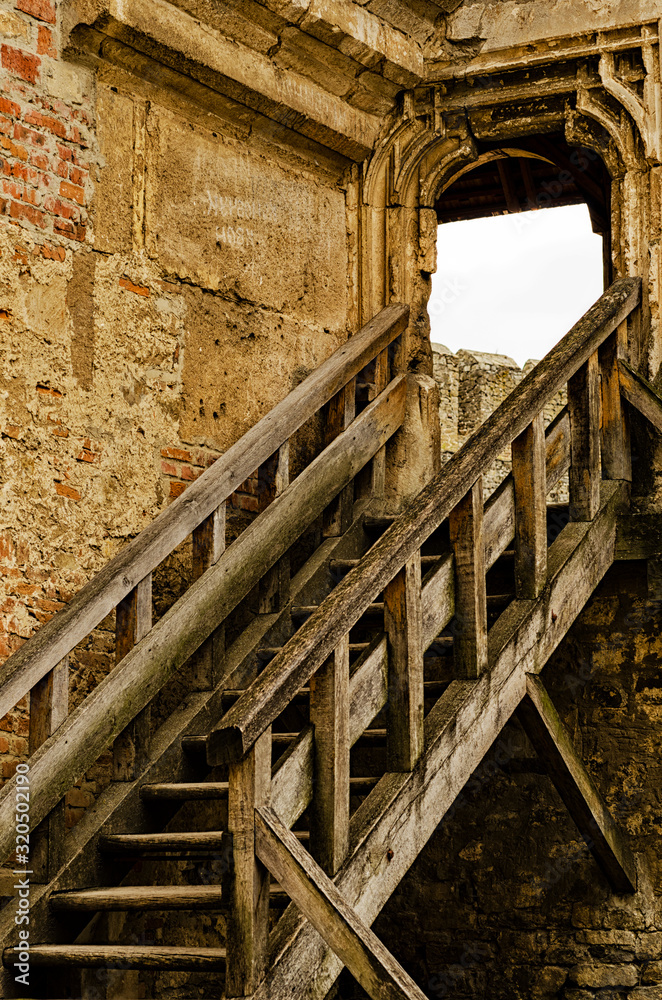 Obraz premium Wooden staircase of an old castle, handmade