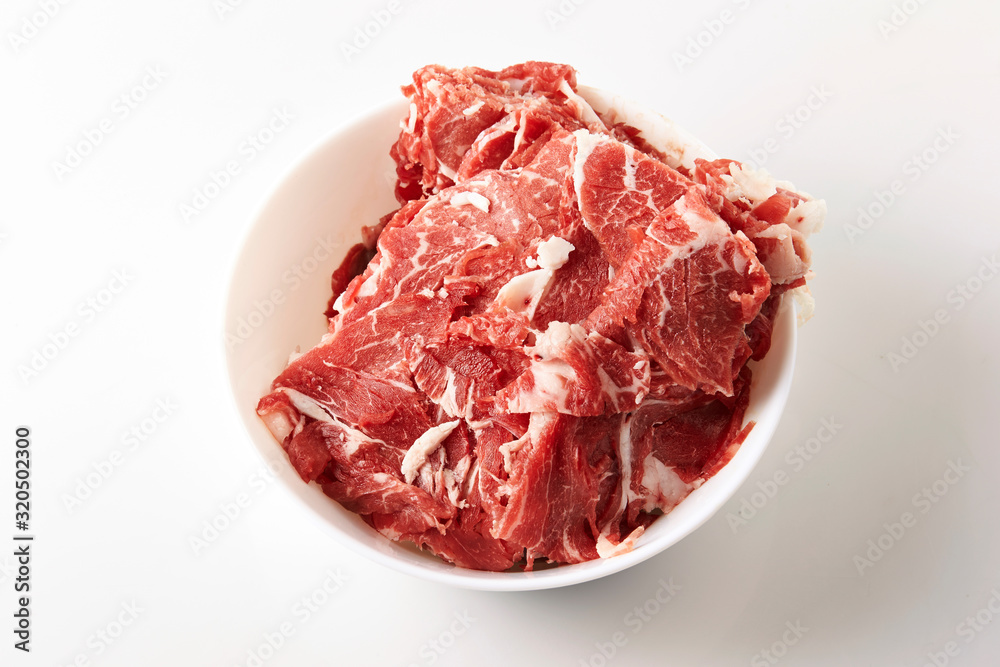 Frozen beef in white bowl Frozen beef in white bowl
