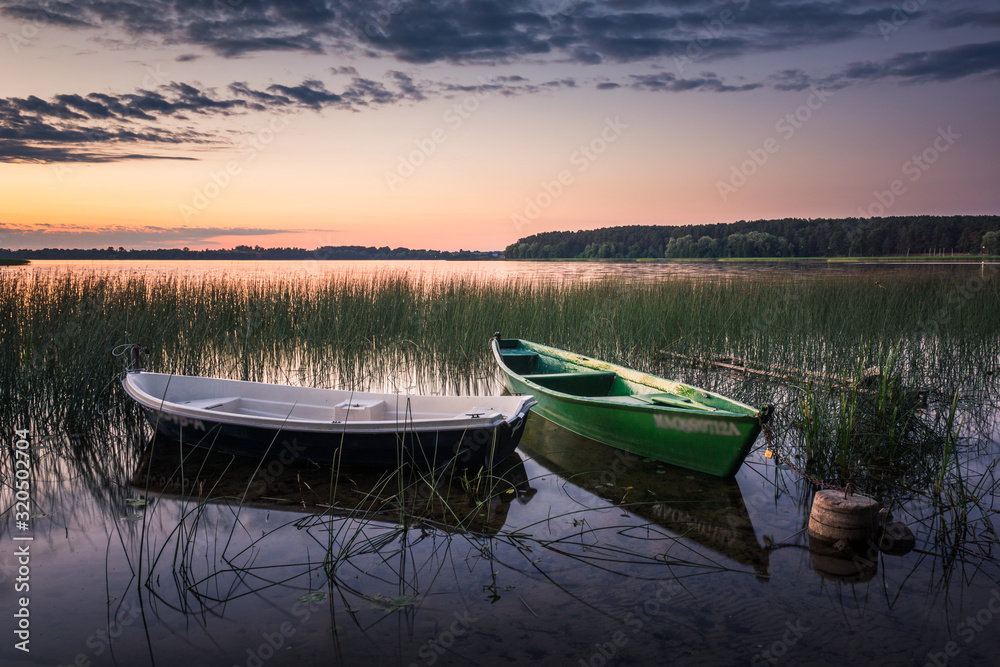 Obraz premium Boats over the Lasmiady lake near Elk, Masuria, Poland