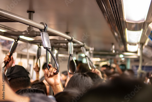 Crowd inside the train in rush hour photo