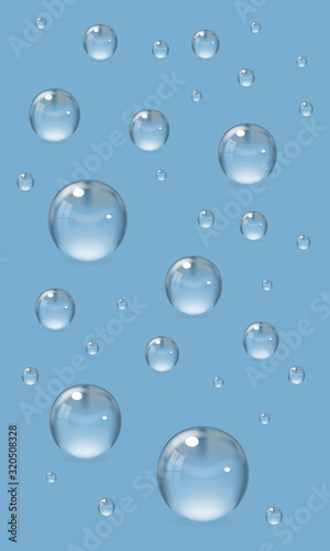 Realistic set of transparent drops of various sizes. Design elements isolated on blue background. Vector illustration