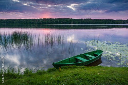 Obraz na płótnie Boat on the Olecko Wielkie lake in Olecko, Masuria, Poland w salonie