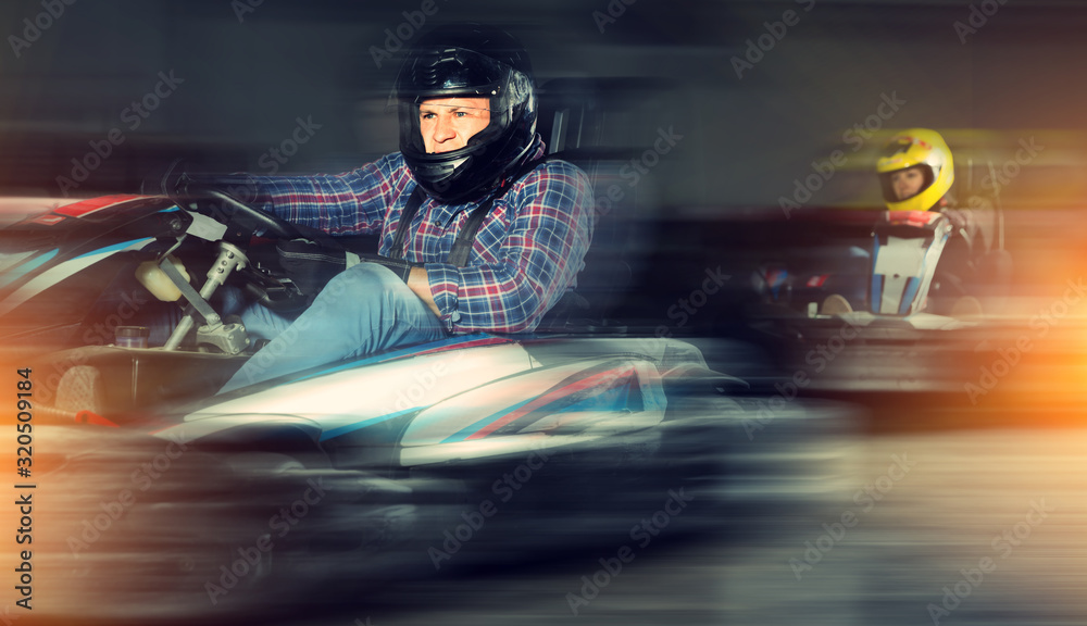 Portrait of man driving racing car