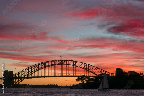 Fototapeta Naklejka Na Ścianę i Meble -  Sydney Harbour Bridge landmark against colorful sunset sky