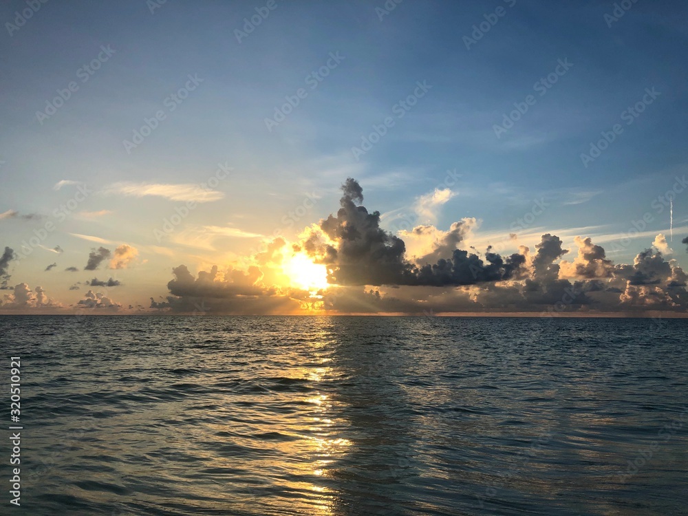 sunrise over the ocean, spectacular cloudscapes, shadows and colors sunrise over the ocean, spectacular cloudscapes, shadows and colors