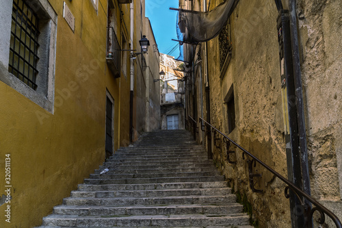 Narrow Passageway in jewish quarter of Girona - the old town of Catalonia  Spain .