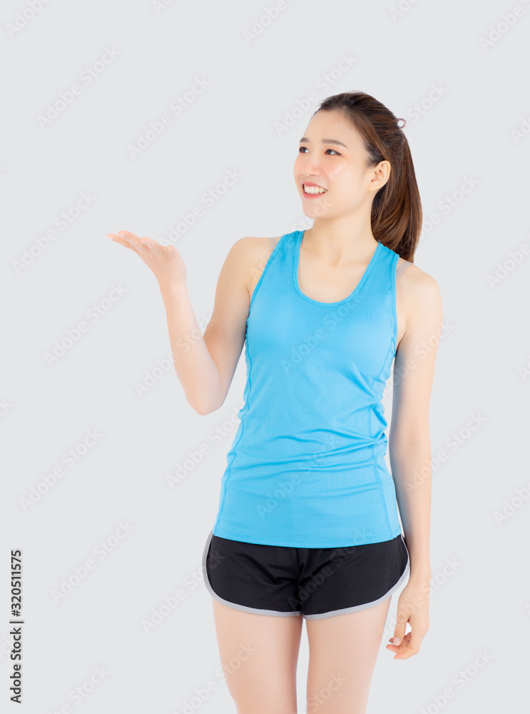 Beautiful portrait young asian woman in sport with satisfied and holding and throw green apple isolated on white background, girl asia have shape and wellness, exercise for fit with health concept. Beautiful portrait young asian woman in sport with satisfied and holding and throw green apple isolated on white background, girl asia have shape and wellness, exercise for fit with health concept.