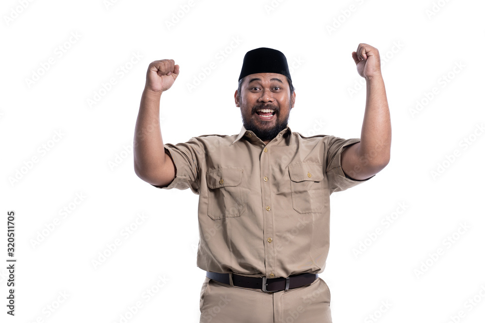 excited male worker wearing brown uniform raised his arm. pegawai negeri sipil indonesian government employees excited male worker wearing brown uniform raised his arm. pegawai negeri sipil indonesian government employees