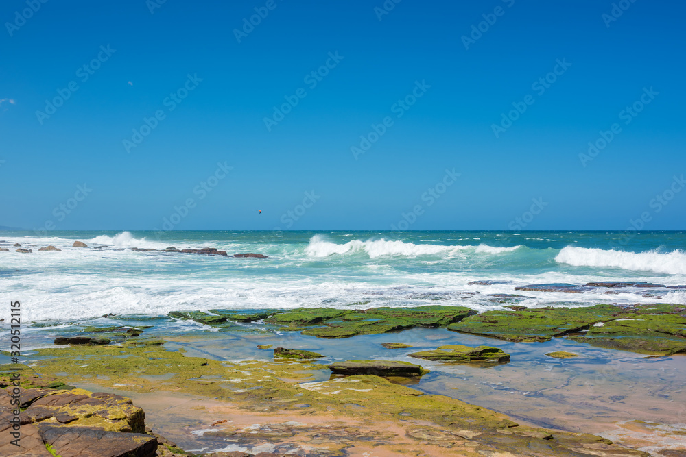 Summer sea background with soft waves and clear sky Summer sea background with soft waves and clear sky