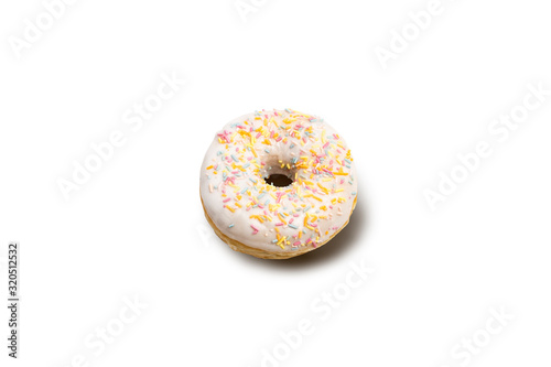 Donut with multi-colored decorative crumbs on a white isolated background. Bakery, baking concept