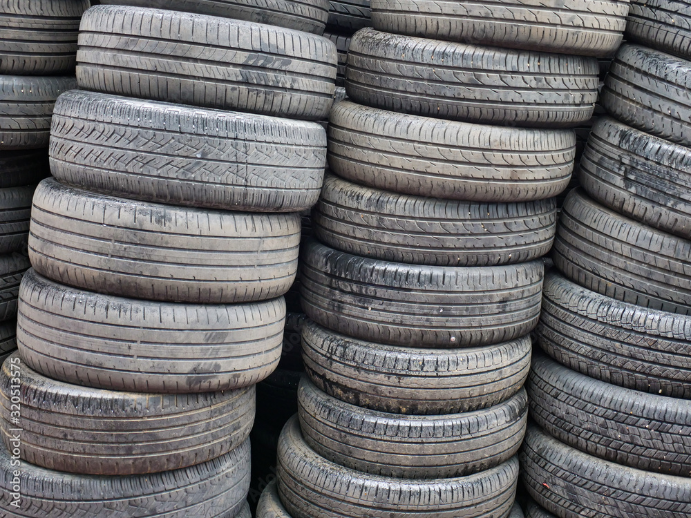 Stacks of old used Car tires in a local warehouse. Stacks of old used Car tires in a local warehouse.