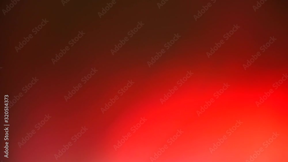 A texture made from the movement of white and red light in a bokeh effect.