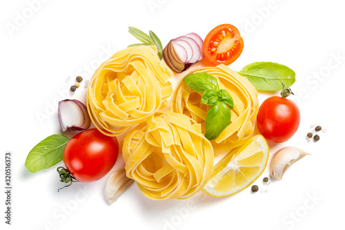 Italian cuisine concept - raw pasta and ingredients. Healthy vegetarian diet, isolated on white