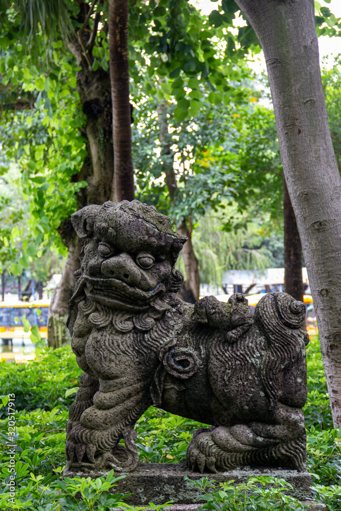 chinese mythial beast kirin kilin lion statue in the garden