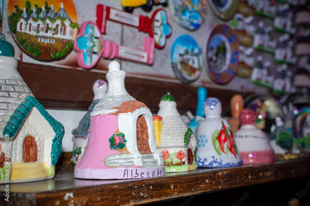 Fototapeta premium Colored souvenirs from Alberobello, South of Italy on Blurred background