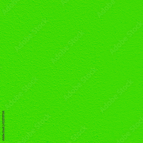 Seamless background of a green rough painted wall, texture