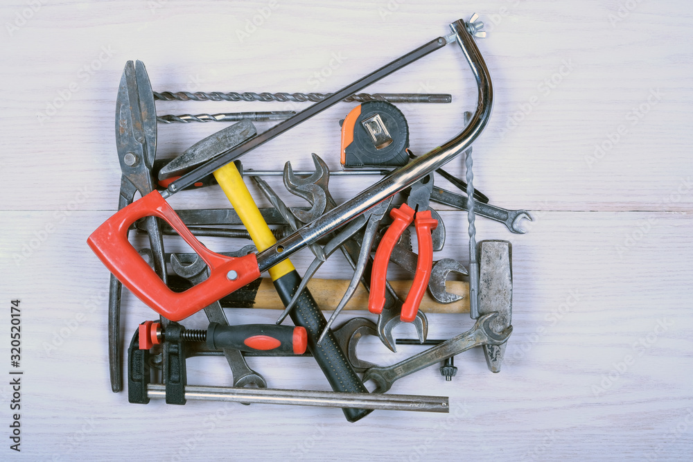   hand tools: hammer, saw, adjustable wrench, screwdriver, open-end wrenches, pliers, etc.