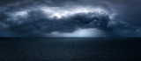 dark and dramatic stormy clouds over sea